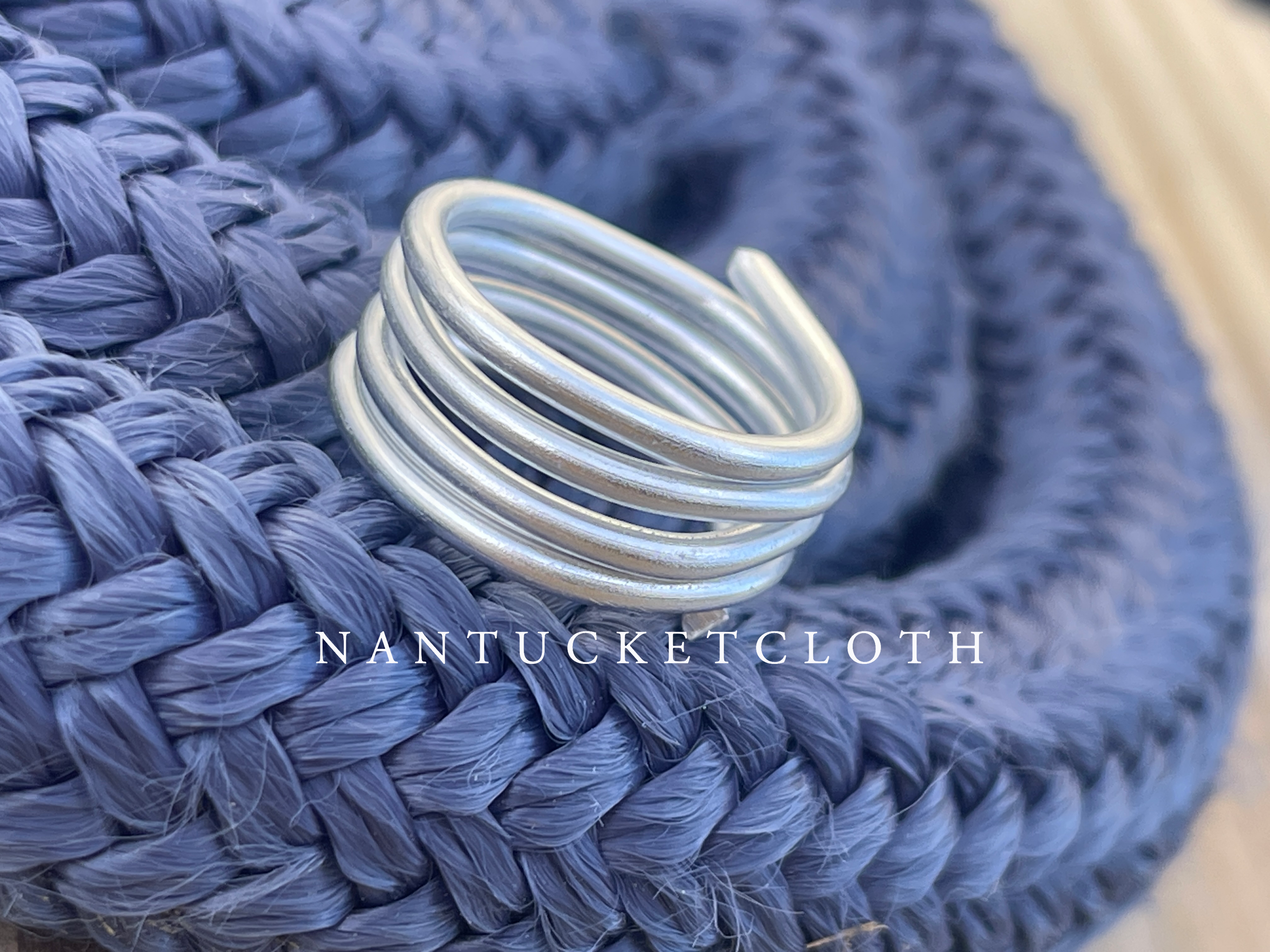 Nantucket Rings from Nantucketcloth showcase a soft metal stacked design. This ring is a one piece full connected stack style Nautical Ring