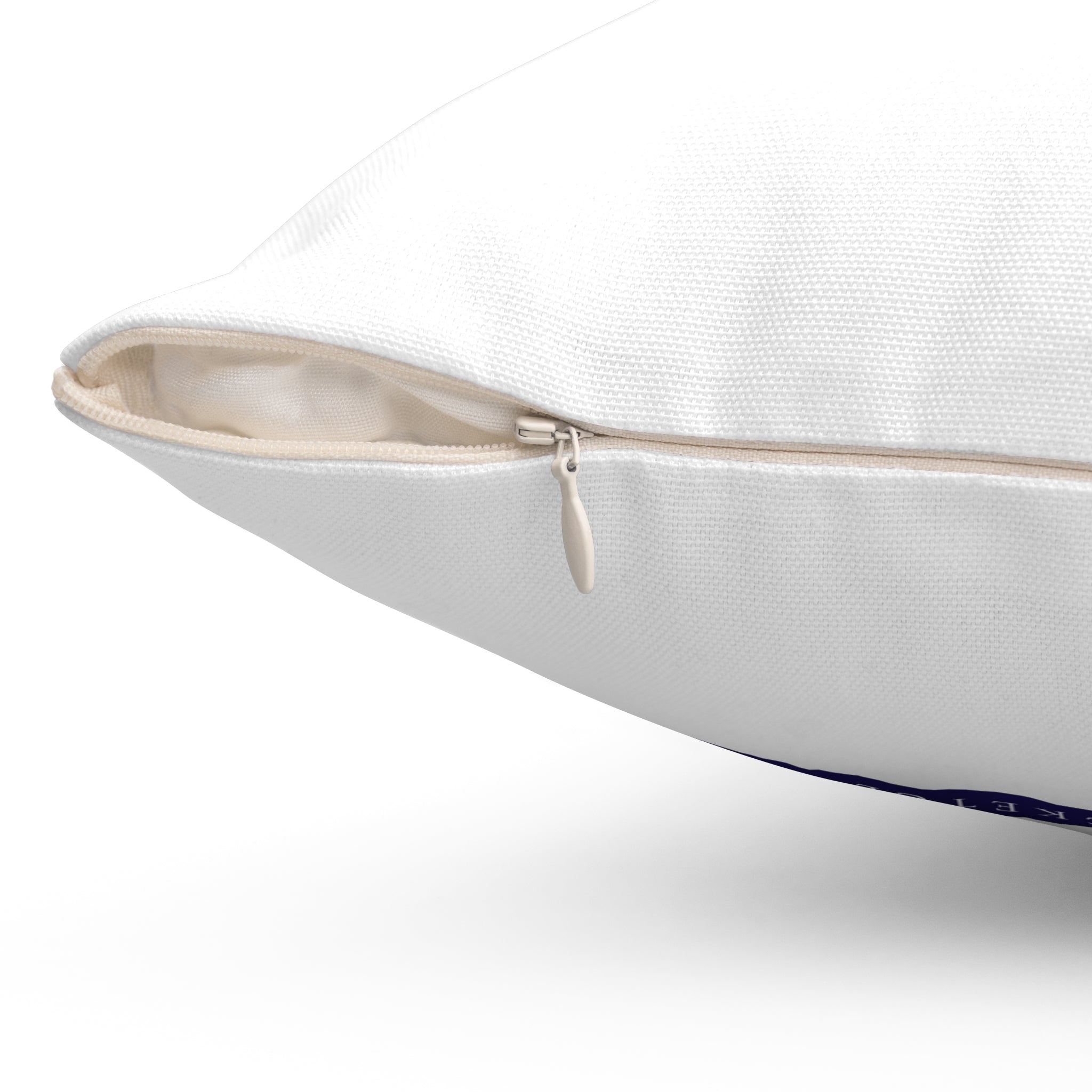 Close-up of a white pillow with a zipper on a white background