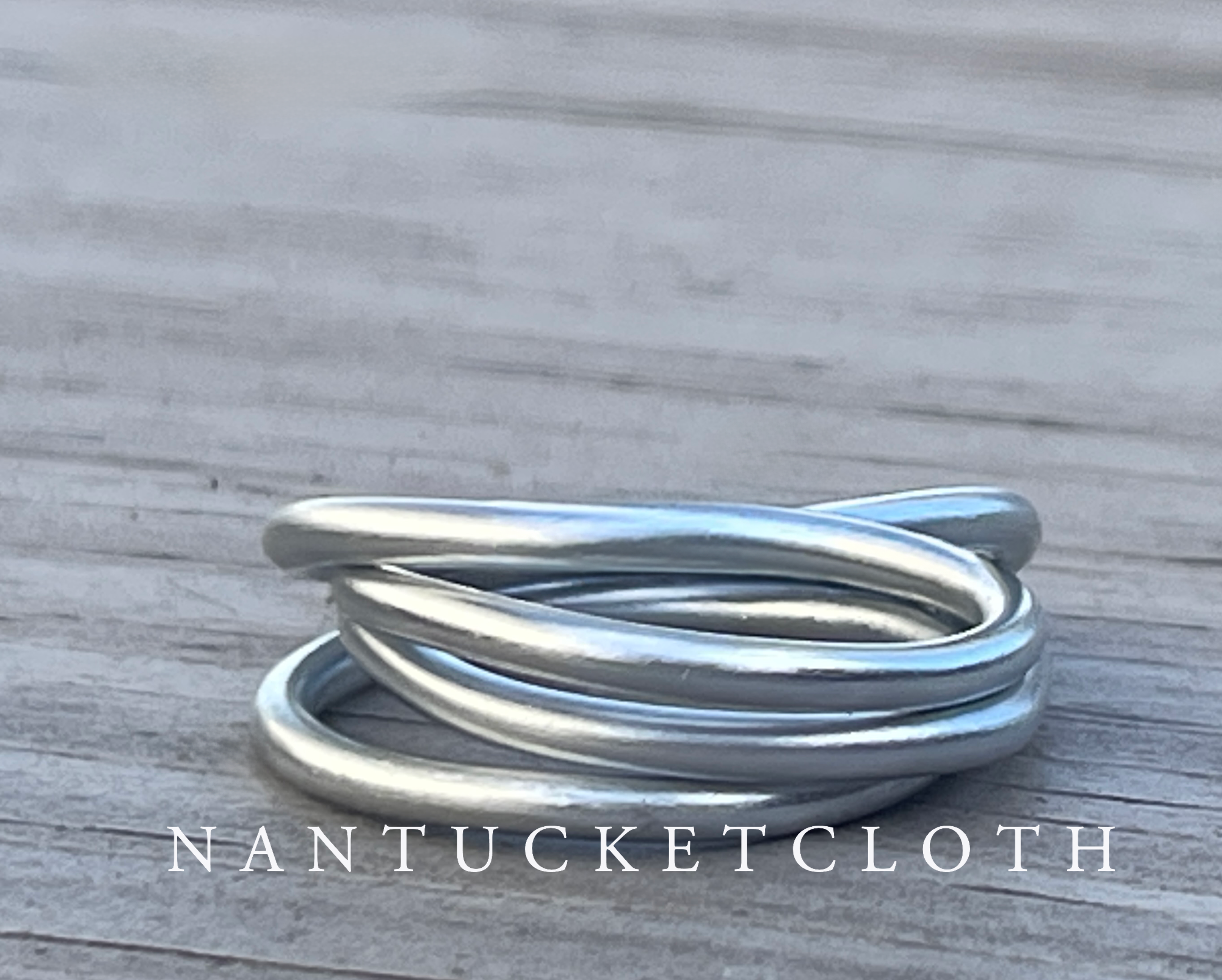 Nantucket Rings from Nantucketcloth showcase a soft metal stacked design.  One Piece