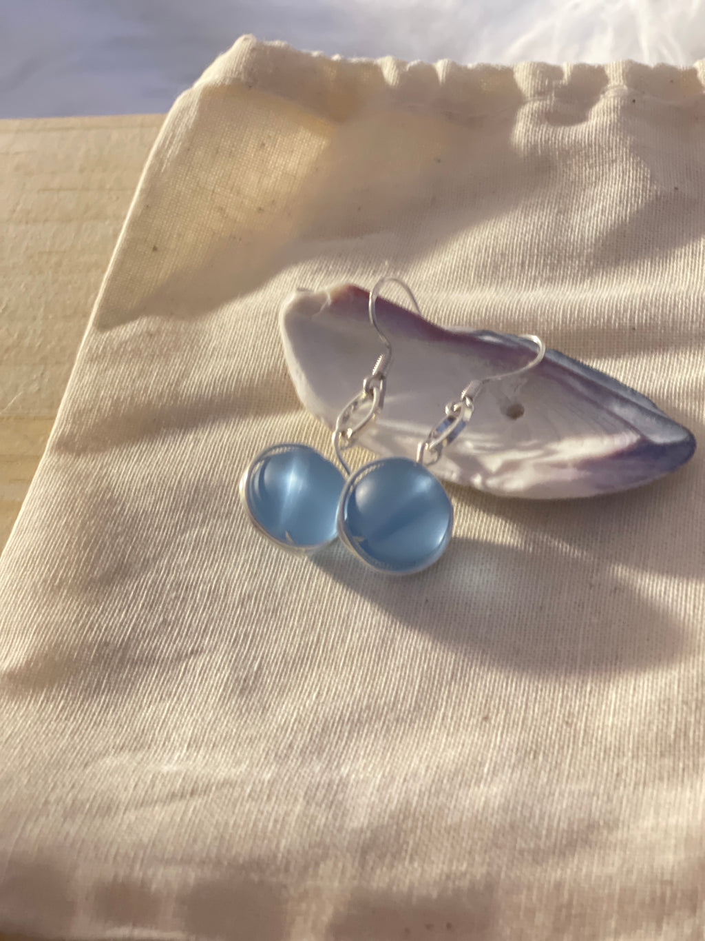 Nantucket jewelry, One of a Kind Design. Nantucketcloth Silver hugged round beach glass earrings . All sales are final. 