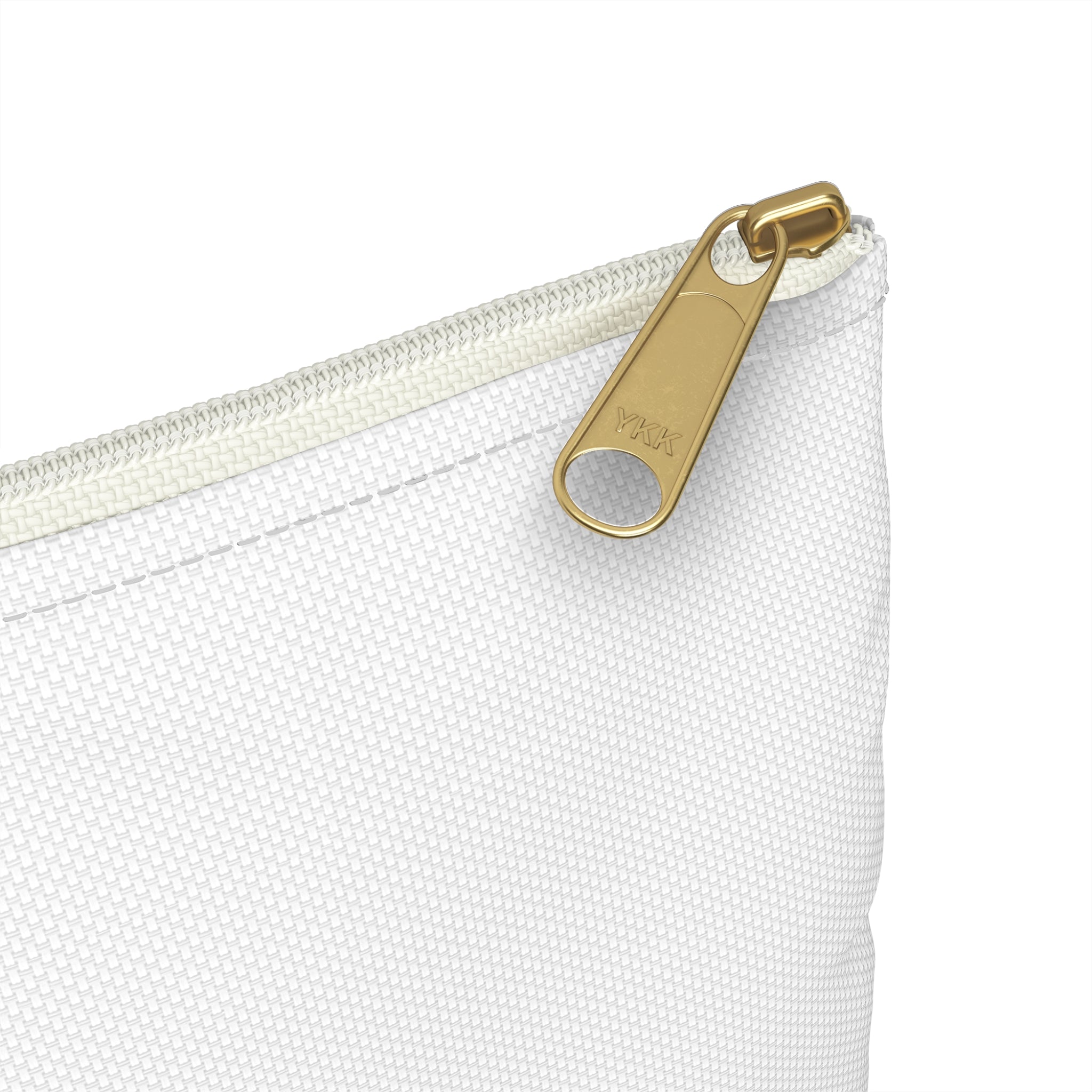 Close-up of a white pouch with a gold zipper pull on a white background