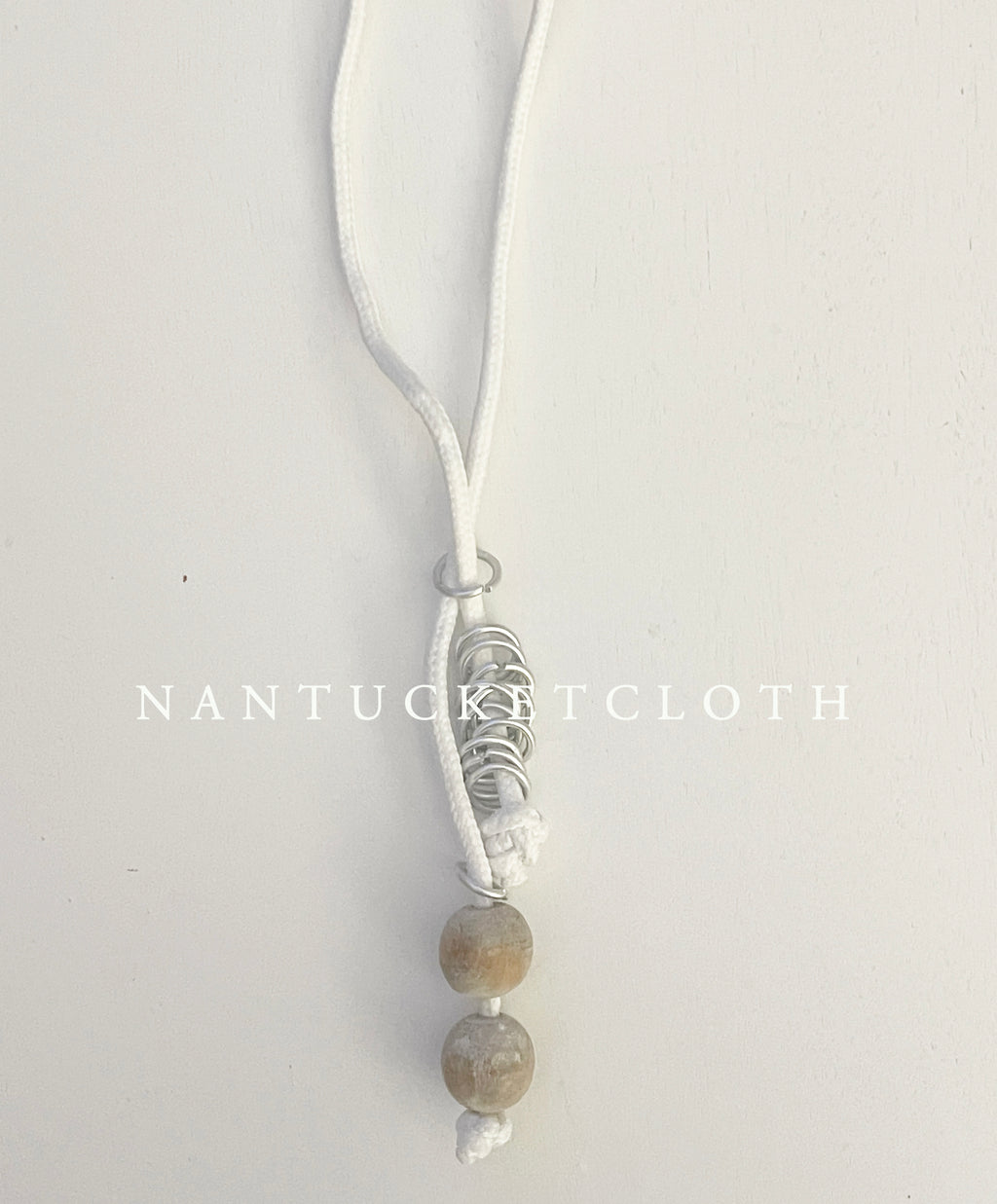 Newport Rhode Island Nantucketcloth White Nautical Rope With Hand Crafted Metal Rings Highlighting Beach wood crafted beads with a clip front Necklace.