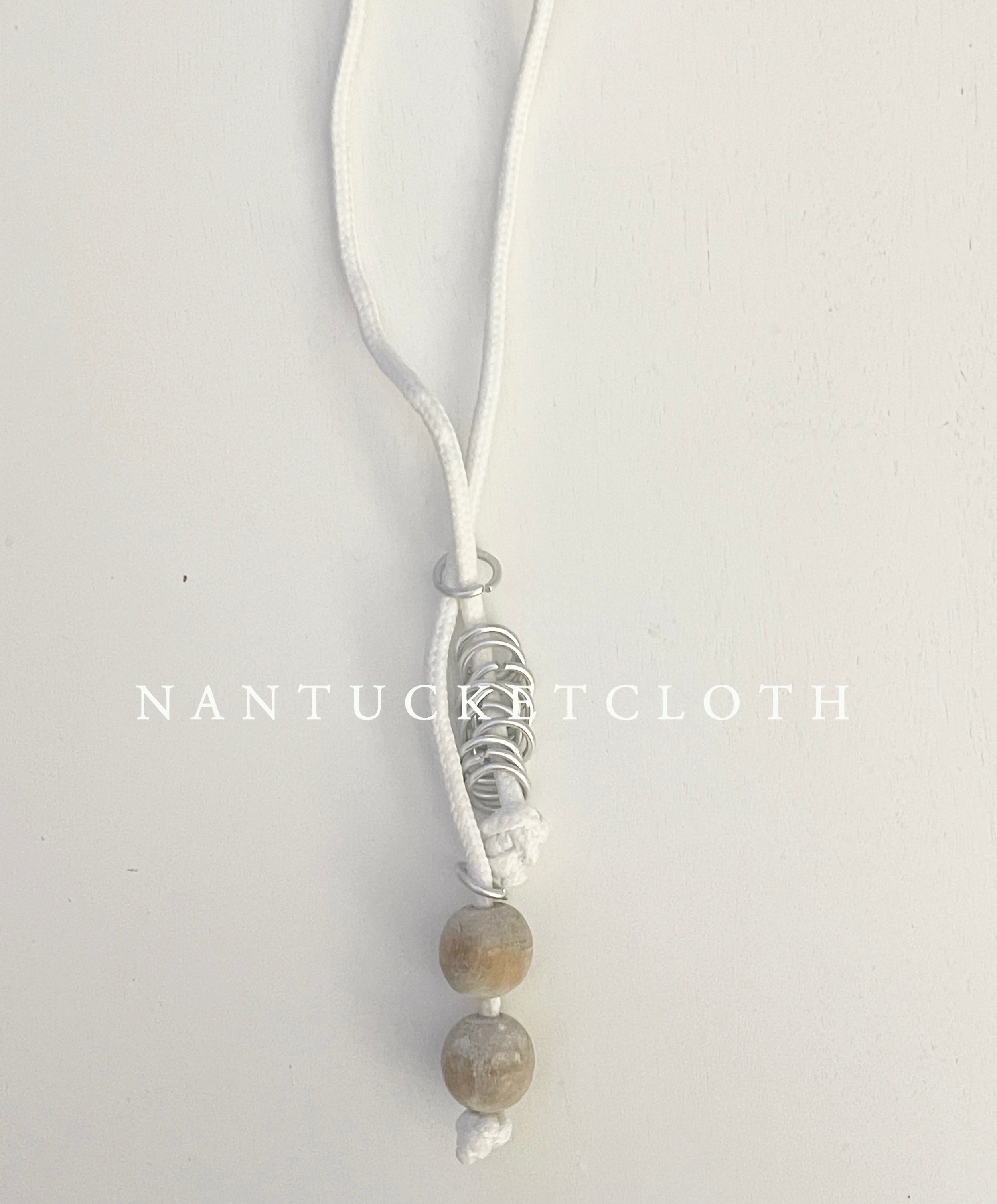 Newport Rhode Island Nantucketcloth White Nautical Rope With Hand Crafted Metal Rings Highlighting Beach wood crafted beads with a clip front Necklace.